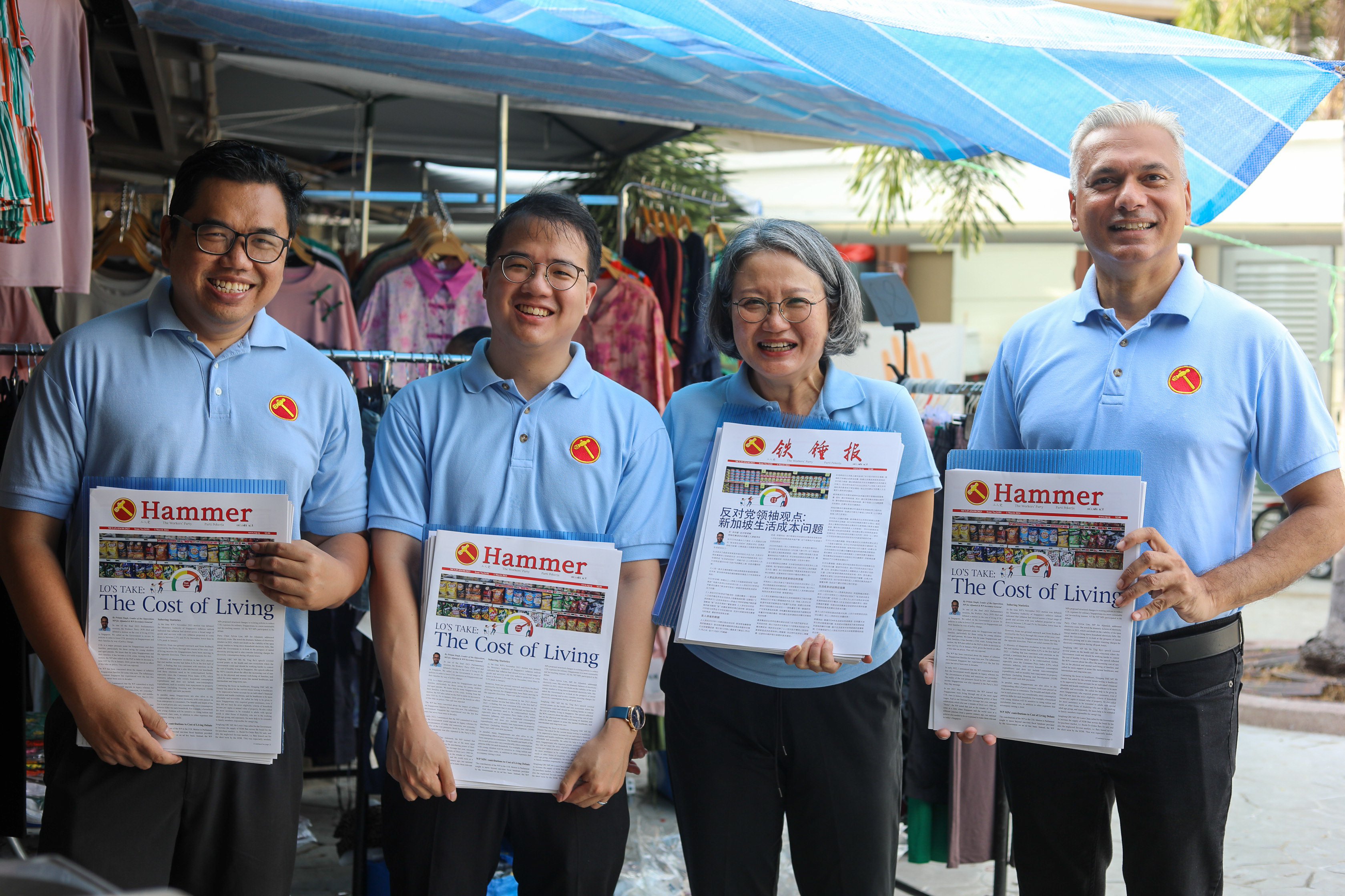 Andre holding the Hammer newsletter alongside other WP members